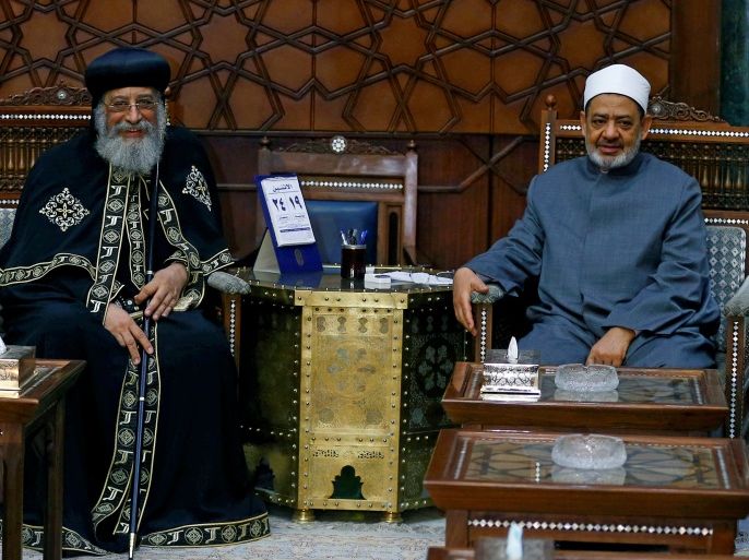 Egyptian Coptic Pope Tawadros II, head of the Egyptian Coptic Orthodox Church (L) congratulates Sheikh Ahmed Mohamed el-Tayeb, Egyptian Imam of al-Azhar Mosque (R) in occasion of Al-Fitr feast, in Cairo, Egypt June 19, 2017. REUTERS/Mohamed Abd El Ghany