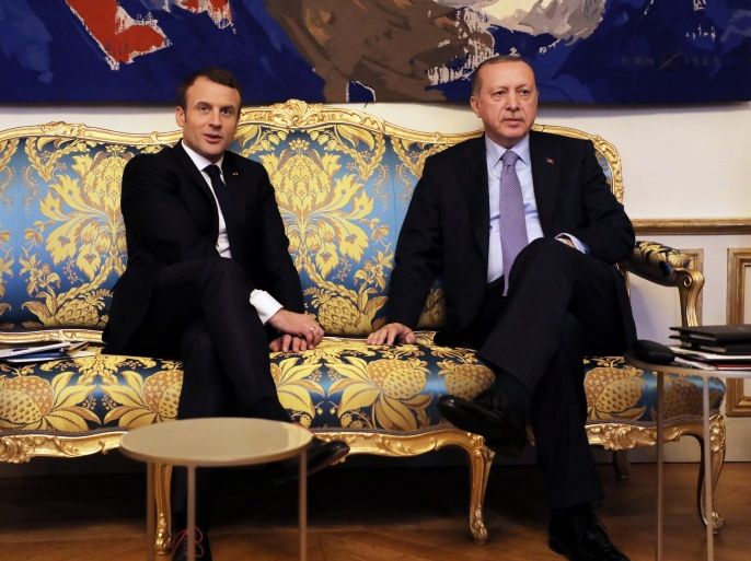 French President Emmanuel Macron (L) meets with Turkish President Recep Tayyip Erdogan at the Elysee Palace in Paris, France, January 5, 2018. REUTERS/Ludovic Marin/Pool