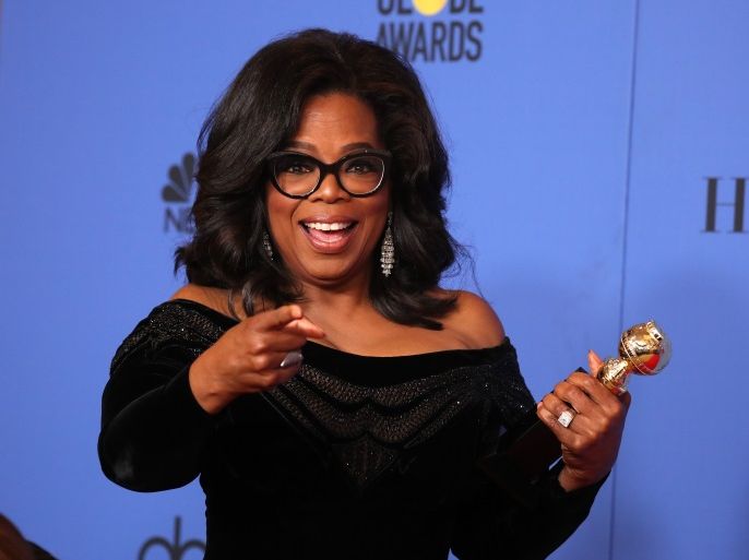 75th Golden Globe Awards – Photo Room – Beverly Hills, California, U.S., 07/01/2018 – Oprah Winfrey poses backstage with her Cecil B. DeMille Award. REUTERS/Lucy Nicholson