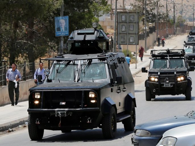Jordanian security vehicles seen near the General Intelligence directorate offices near al Baqaa Refugee Camp, north of Amman, Jordan, June 6, 2016. REUTERS/Muhammad Hamed