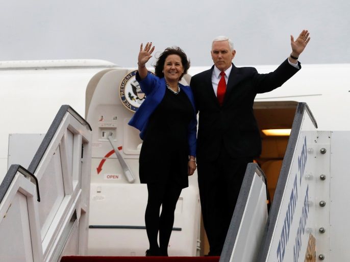 U.S. Vice President Mike Pence and his wife Karen wave as they board an airplane ahead of their departure from Ben Gurion International airport in Lod, near Tel Aviv, Israel January 23, 2018. REUTERS/Ronen Zvulun