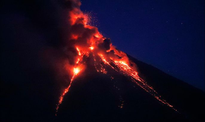 Mayon Volcano spews ash and lava in the town of Daraga, Albay province, Philippines, 23 January 2018