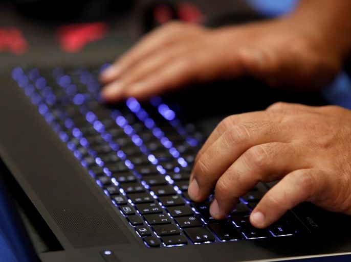 A man types into a keyboard during the Def Con hacker convention in Las Vegas, Nevada, U.S. on July 29, 2017. REUTERS/Steve Marcus