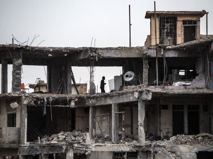 MOSUL, IRAQ - APRIL 11: A man stands in the ruins of a building destroyed during fighting between Iraqi forces and Islamic State, on April 11, 2017 in Mosul, Iraq. Large swathes of Mosul have been severely damaged by six months of fighting to retake the city, Iraq's second largest, from Islamic State who have held it since 2014. (Photo by Carl Court/Getty Images)