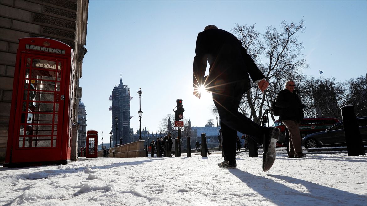 People walk through snow in Westminster, London, Britain, February 28, 2018. REUTERS/Peter Nicholls