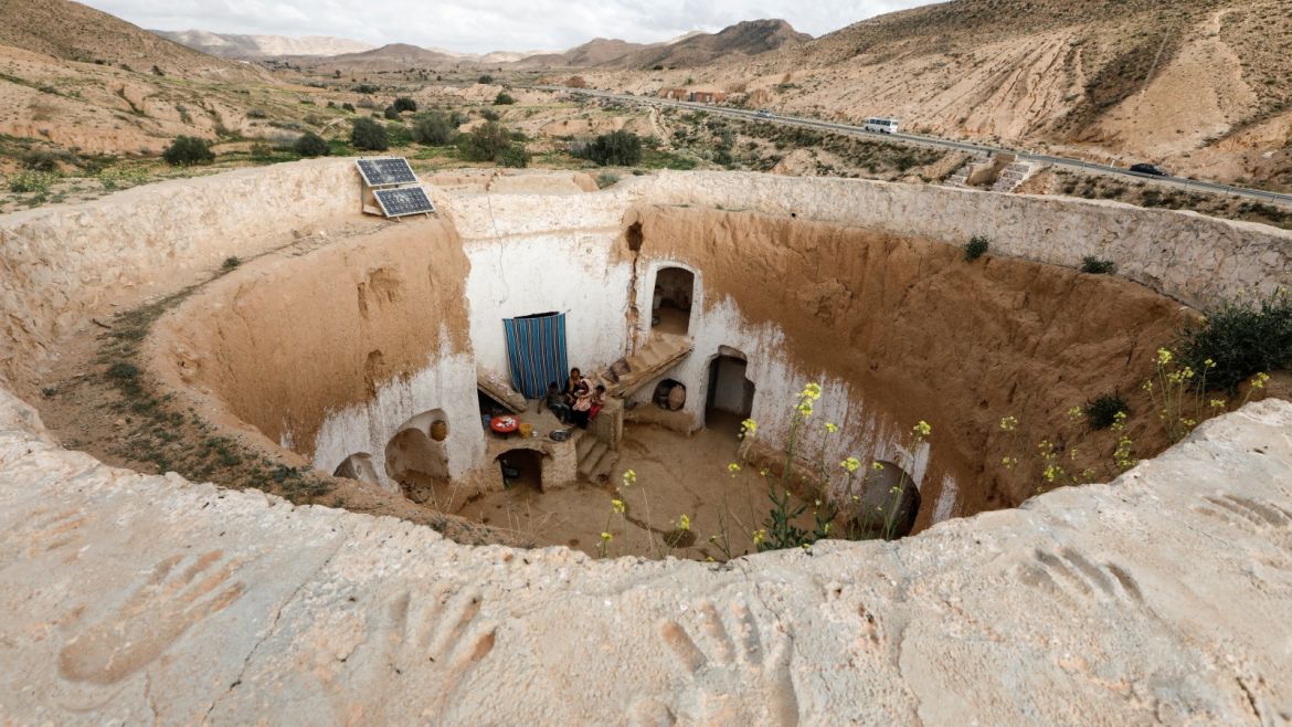 Saliha Mohamedi, 36, sits with her children at their troglodyte house on the outskirts of Matmata, Tunisia, February 4, 2018.