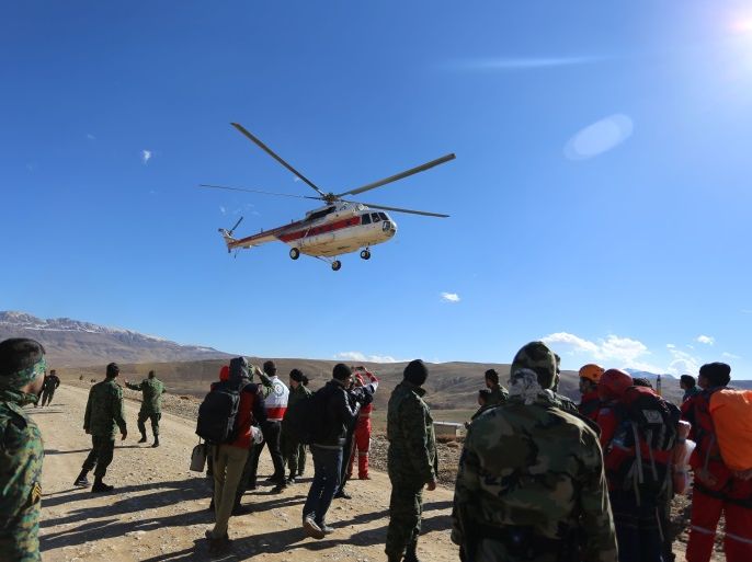 Members of emergency and rescue team search for the plane that crashed in a mountainous area of central Iran, February 19, 2018. REUTERS/Tasnim News Agency ATTENTION EDITORS - THIS PICTURE WAS PROVIDED BY A THIRD PARTY.