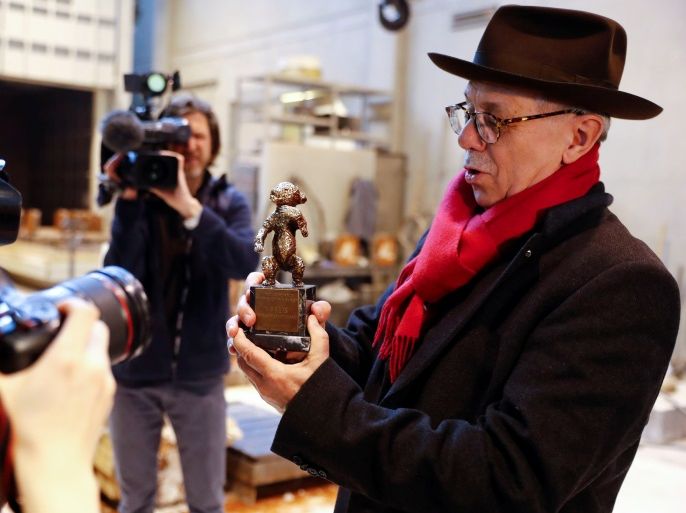 Berlinale International Film Festival director Dieter Kosslick holds a 1950 Berlin Bear award prototype during a media event for the upcoming film festival at the Noack foundry in Berlin, Germany, January 15, 2018. REUTERS/Fabrizio Bensch