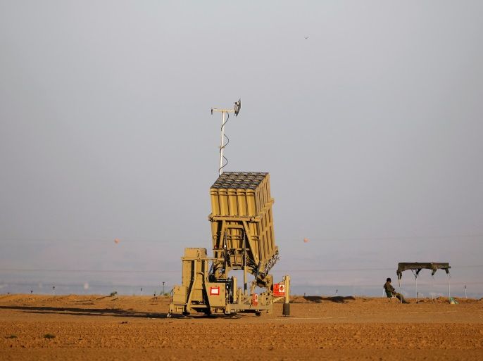 An Israeli soldier keeps watch by an Iron Dome rocket interceptor battery deployed near central Gaza Strip, southern Israel October 31, 2017. REUTERS/Amir Cohen