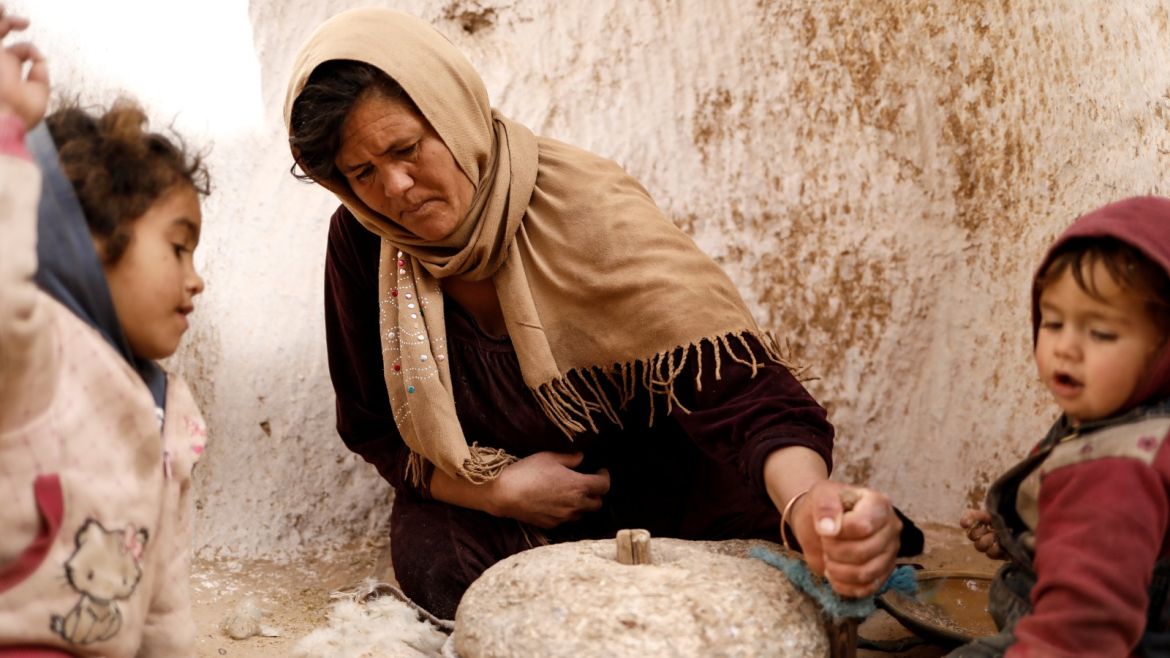 Saliha Mohamedi, 36, grinds wheat at her troglodyte house on the outskirts of Matmata, Tunisia, February 5, 2018.