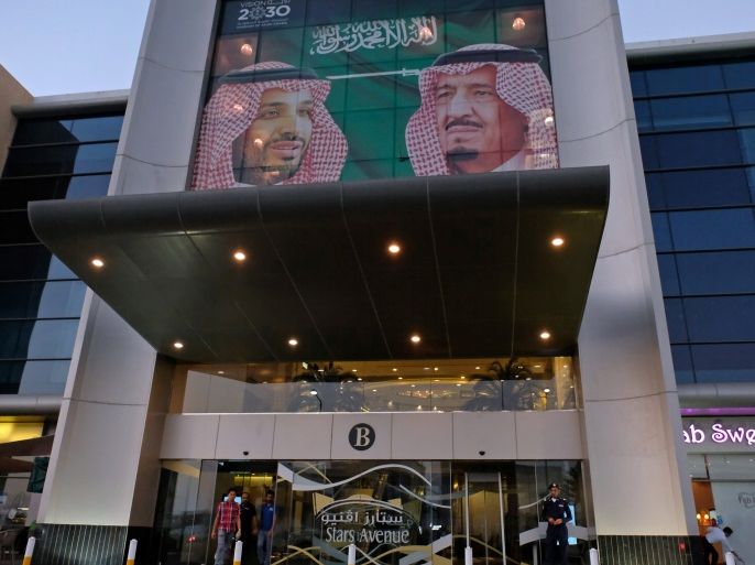 A picture showing Saudi Arabia's King Salman bin Abdulaziz Al Saud and Crown Prince Mohammed bin Salman is seen on a mall in Jeddah, Saudi Arabia November 10, 2017. REUTERS/Reem Baeshen
