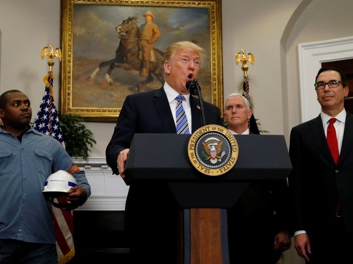 U.S. President Donald Trump makes an announcement about a presidential proclamation placing tariffs on steel and aluminum imports while surrounded by workers from the steel and aluminum industries at the White House in Washington, U.S. March 8, 2018. REUTERS/Leah Millis