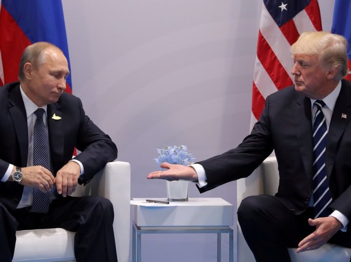 U.S. President Donald Trump meets with Russian President Vladimir Putin during their bilateral meeting at the G20 summit in Hamburg, Germany, July 7, 2017. Carlos Barria:
