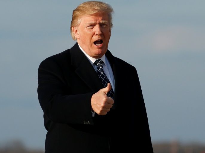 U.S. President Donald Trump gives thumbs-up as he returns from Palm Beach, Florida, at Joint Base Andrews in Maryland, U.S., March 25, 2018. REUTERS/Joshua Roberts