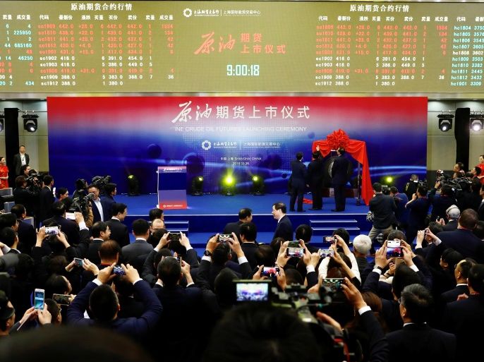 People attend the launch ceremony of Shanghai crude oil futures at the Shanghai International Energy Exchange (INE) in Shanghai, China March 26, 2018. China Daily via REUTERS ATTENTION EDITORS - THIS IMAGE WAS PROVIDED BY A THIRD PARTY. CHINA OUT.