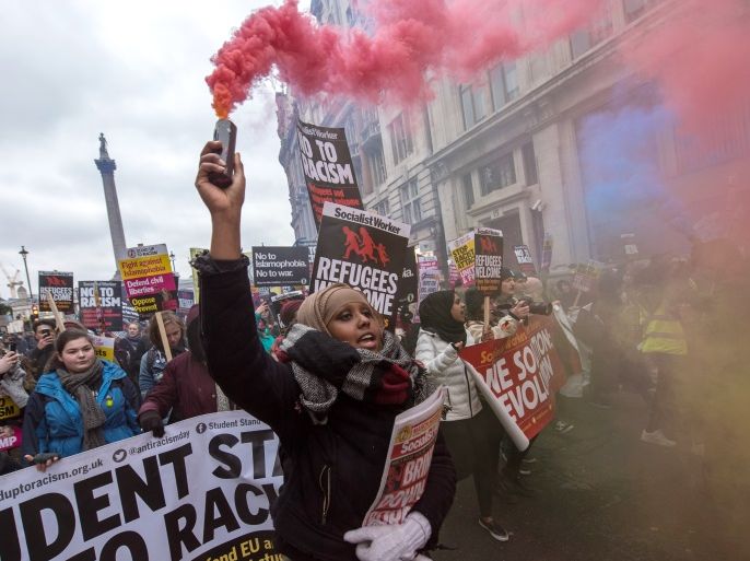 LONDON, ENGLAND - MARCH 17: Anti-racism demostrators let off flares during a march against racism on March 17, 2018 in London, England. The march is organised by the group Stand Up to Racism as an expression of unity against racism, Islamophobia and anti-Semitism. (Photo by Chris J Ratcliffe/Getty Images)