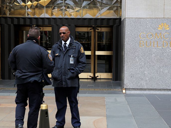 Police and security stand outside 30 Rockefeller Plaza, the location for the offices of U.S. President Donald Tump's lawyer Michael Cohen, in the Manhattan borough of New York City