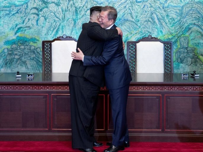 South Korean President Moon Jae-in and North Korean leader Kim Jong Un embrace at the truce village of Panmunjom inside the demilitarized zone separating the two Koreas, South Korea, April 27, 2018. Korea Summit Press Pool/Pool via Reuters TPX IMAGES OF THE DAY