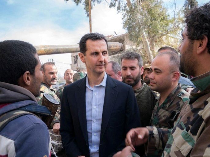 Syrian President Bashar al-Assad meets with Syrian army soldiers in eastern Ghouta, Syria, March 18, 2018. SANA/Handout via REUTERS ATTENTION EDITORS - THIS IMAGE HAS BEEN SUPPLIED BY A THIRD PARTY. REUTERS IS UNABLE TO INDEPENDENTLY VERIFY THIS IMAGE.