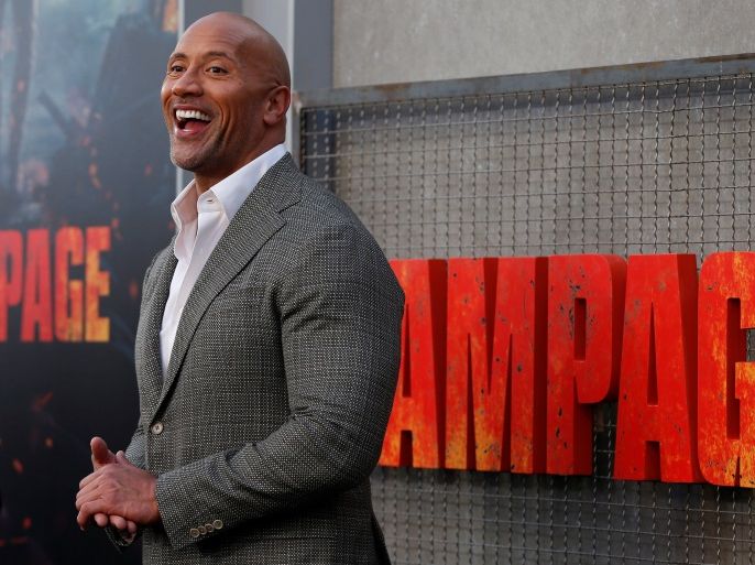 Cast member Dwayne Johnson poses at the premiere for the movie