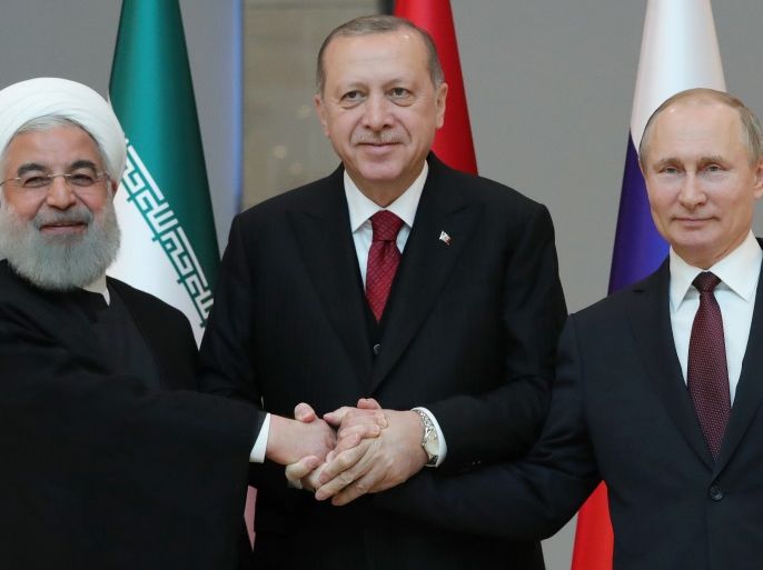 Erdogan (C), Putin (R) and Rouhani during their meeting at the Presidential Palace in Ankara 04 April 2018
