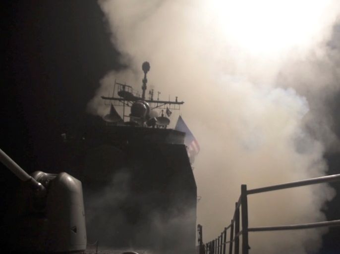 Smoke rises as the U.S. Navy guided-missile cruiser USS Monterey fires Tomahawk land attack missiles in this still image from Pentagon's video released on April 14, 2018. U.S. Navy Lt. j.g Matthew Daniels/Handout via REUTERS. ATTENTION EDITORS - THIS IMAGE WAS PROVIDED BY A THIRD PARTY