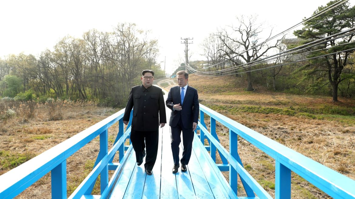 South Korean President Moon Jae-in and North Korean leader Kim Jong Un walk together at the truce village of Panmunjom inside the demilitarized zone separating the two Koreas, South Korea, April 27, 2018.   Korea Summit Press Pool/Pool via Reuters