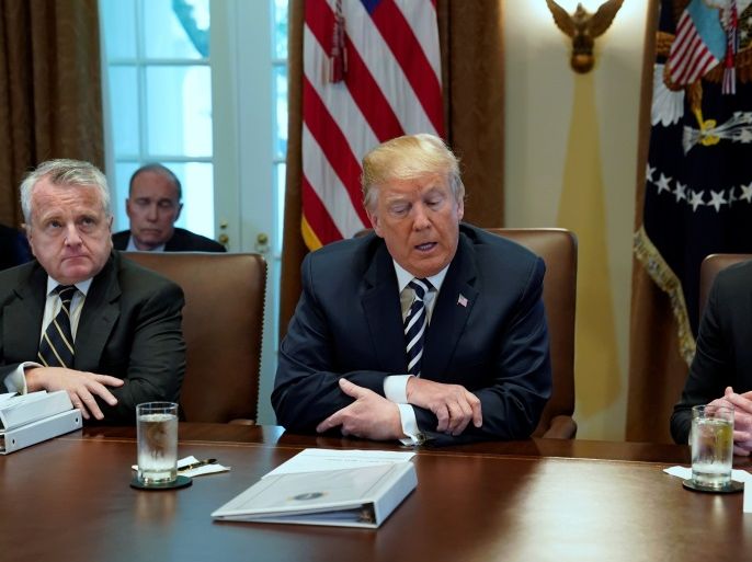 U.S. President Donald Trump, flanked by Deputy Secretary of State John Sullivan (L) and Deputy Secretary of Defense Patrick Shanahan (R), holds a cabinet meeting at the White House in Washington, U.S. May 9, 2018. REUTERS/Jonathan Ernst