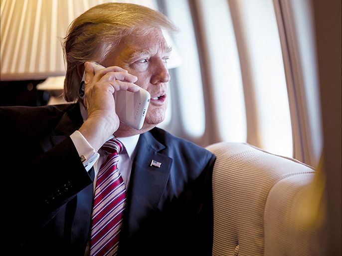 President Donald Trump talks on the phone aboard Air Force One during a flight to Philadelphia on Jan. 26, 2017. | Shealah Craighead/Official White House Photo