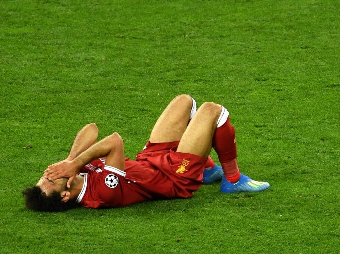 KIEV, UKRAINE - MAY 26: Mohamed Salah of Liverpool reacts as he goes down injured during the UEFA Champions League Final between Real Madrid and Liverpool at NSC Olimpiyskiy Stadium on May 26, 2018 in Kiev, Ukraine. (Photo by Mike Hewitt/Getty Images)
