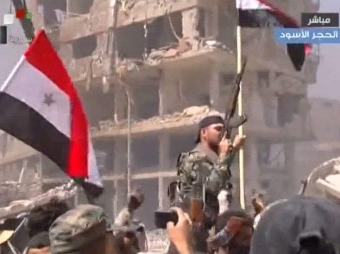 صورة بثها تلفزيون النظام السوري لسيطرة قوات النظام على حي الحجر الأسود ومخيم اليرموك