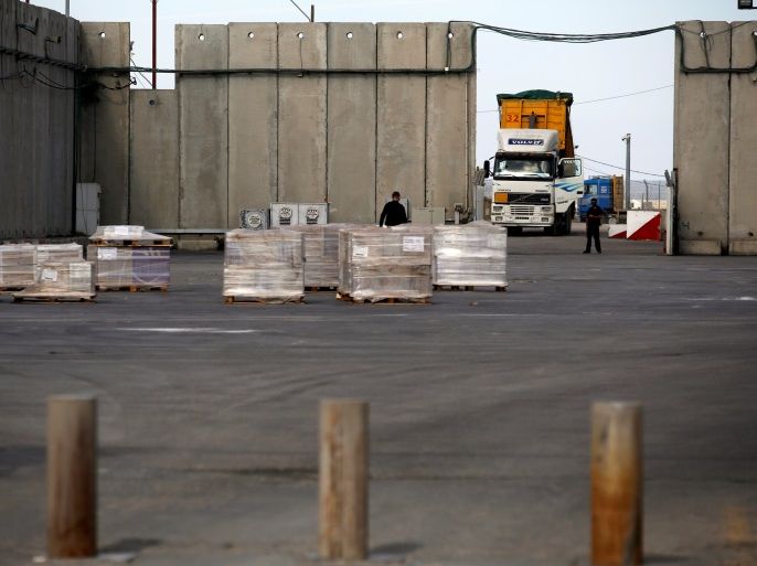 A truck parks next to a security barrier inside the Kerem Shalom border crossing terminal between Israel and Gaza Strip