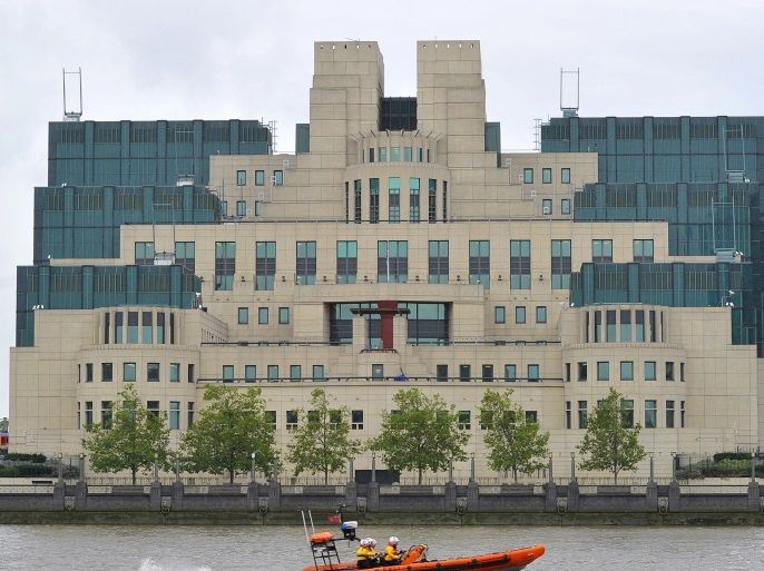 A motorboat passes by the MI6 building in London August 25, 2010. REUTERS/Toby Melville/File Photo