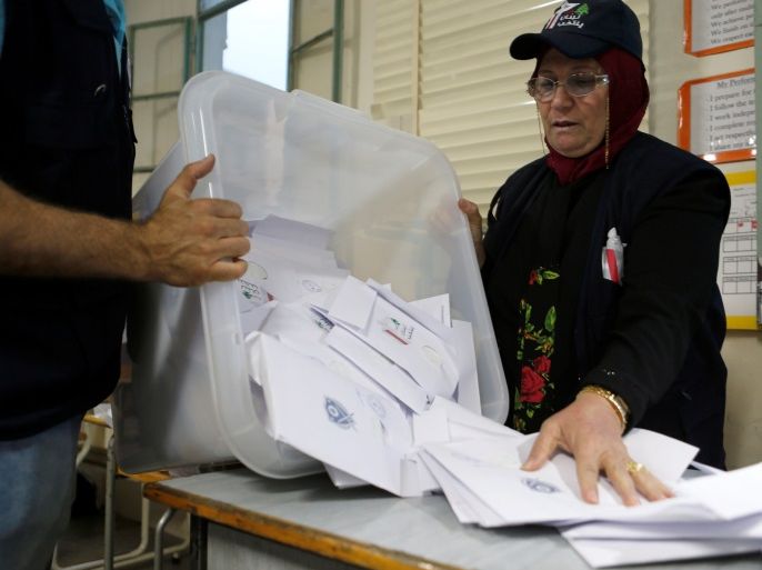A Lebanese election official empties a ballot box after the polling station closed during Lebanon's parliamentary election, in Beirut, Lebanon, May 6, 2018. REUTERS/Mohamed Azakir
