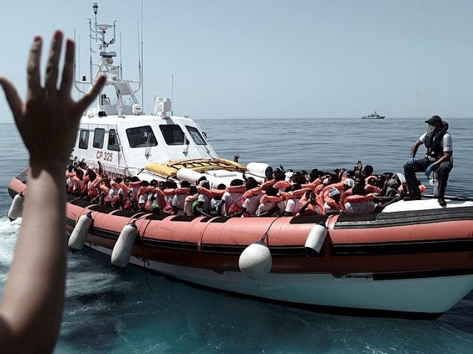 Migrants are seen after being rescued by MV Aquarius, a search and rescue ship run in partnership between SOS Mediterranee and Medecins Sans Frontieres in the central Mediterranean Sea, June 12, 2018. Karpov / SOS Mediterranee/Handout via REUTERS ATTENTION EDITORS - THIS IMAGE WAS PROVIDED BY A THIRD PARTY.