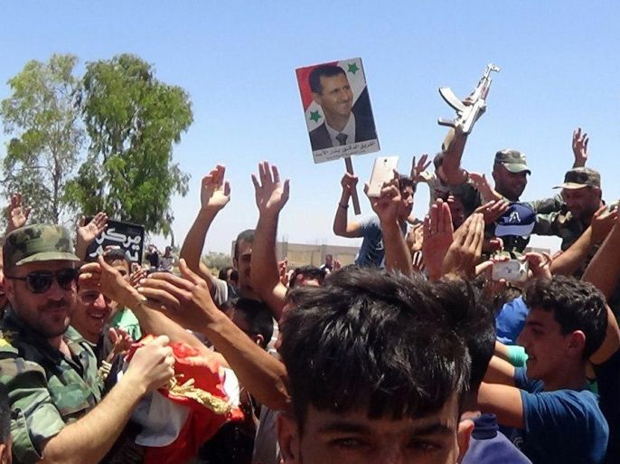 Residents celebrate the army's arrival in the formerly rebel-held town of Ibta, northeast of Deraa city, Syria in this handout released on June 29, 2018. SANA/Handout via REUTERS ATTENTION EDITORS - THIS PICTURE WAS PROVIDED BY A THIRD PARTY. REUTERS IS UNABLE TO INDEPENDENTLY VERIFY THE AUTHENTICITY, CONTENT, LOCATION OR DATE OF THIS IMAGE