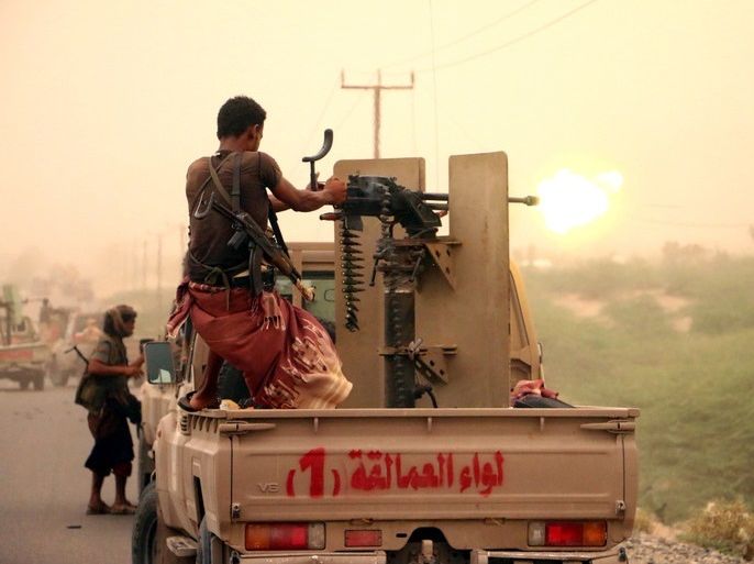 epa06808617 A member of Yemeni government forces fires a heavy machine gun during an offensive against Houthi positions on the outskirts of the western port city of Hodeidah, Yemen, 14 June 2018. According to reports, Yemeni government forces backed by the Saudi-led coalition continued to attack Houthi positions in Hodeidah, in an attempt to gain control of the Houthis-held Red Sea port city, which is the main entry for food into the Arab country. EPA-EFE/NAJEEB ALMAHBOOBI