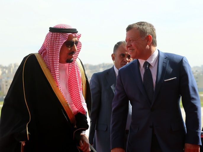 AMMAN, JORDAN - MARCH 27: In this Handout photo released by the Jordanian Royal Court, King Abdullah II of Jordan (R) welcomes King Salman bin Abdulaziz Al Saud of Saudi Arabia (L) upon his arrival at Marka military airport on March 27, 2017, in Amman, Jordan. King Salman arrived in Jordan to attend the summit of Arab leaders scheduled on March 29, 2017. (Photo by Jordanian Royal Court via Getty Images)