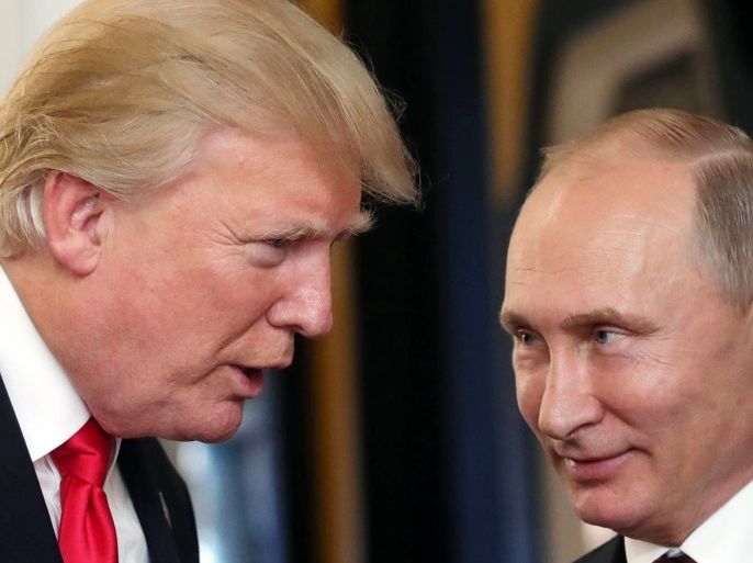 Russian President Vladimir Putin (R) and US President Donald J. Trump (L) talk during a break of a leader's meeting at the 25th Asia-Pacific Economic Cooperation (APEC) summit in Da Nang, Vietnam