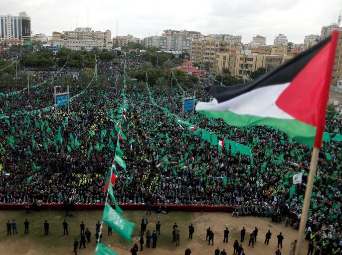 A Palestinian flag flies as Hamas supporters take part in a rally marking the 30th anniversary of Hamas' founding, in Gaza City December 14, 2017. REUTERS/Suhaib Salem