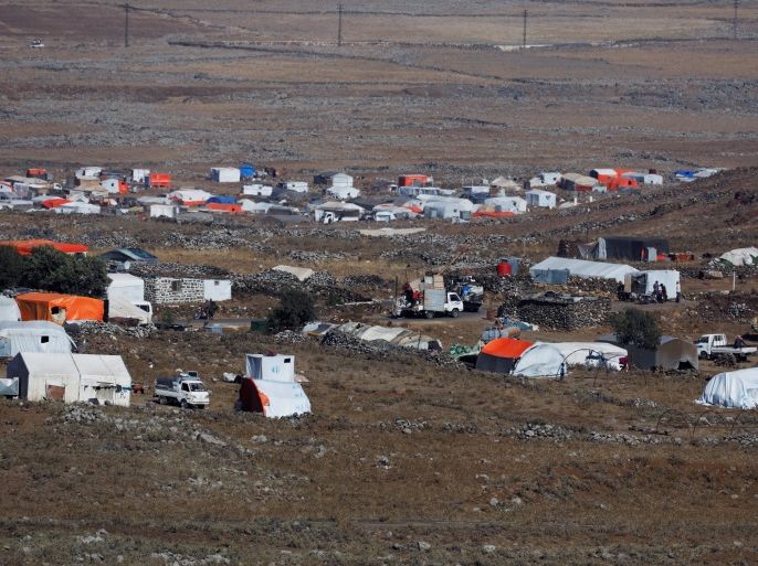 A general view shows refugee tents erected at the Syrian side of the Israeli Syrian border as it is seen from the Israeli-occupied Golan Heights, Israel, July 17, 2018. REUTERS/Ronen Zvulun