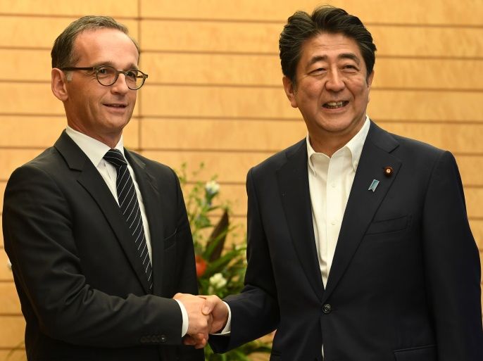 German Foreign Minister Heiko Maas is welcomed by Japanese Prime Minister Shinzo Abe prior to their talks at Abe's official residence in Tokyo, Japan July 25, 2018. Toshifumi Kitamura/Pool via Reuters