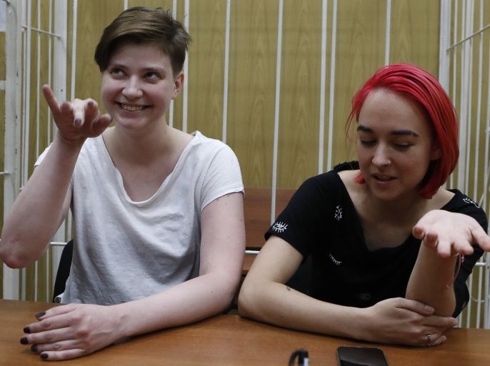 Two of four intruders affiliated to anti-Kremlin punk band Pussy Riot, Olga Pakhtusova (L) and Olga Kurachyova, who ran onto the pitch during the World Cup final between France and Croatia, attend a court hearing in Moscow, Russia July 16, 2018. REUTERS/Sergei Karpukhin
