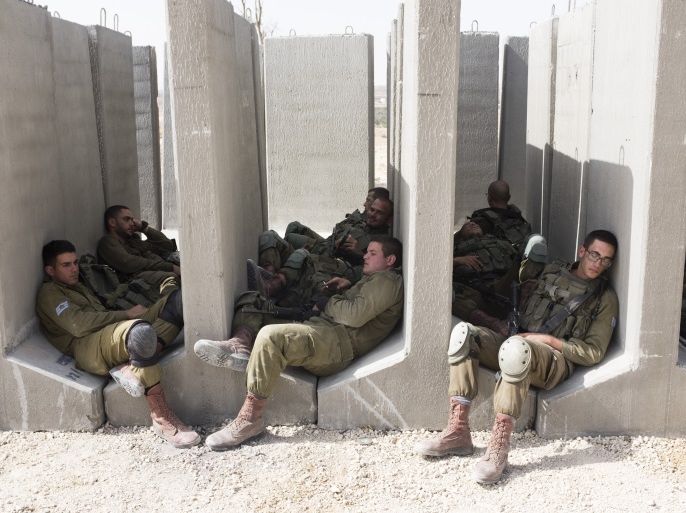 TZEELIM, ISRAEL - JULY 03: (ISRAEL OUT) Israeli soldiers rest before an exercise in built up area on July 3, 2018 in Tzeelim, South Israel. The soldiers practiced fighting in the Gaza Strip against Hamas militants. (Photo by Lior Mizrahi/Getty Images)