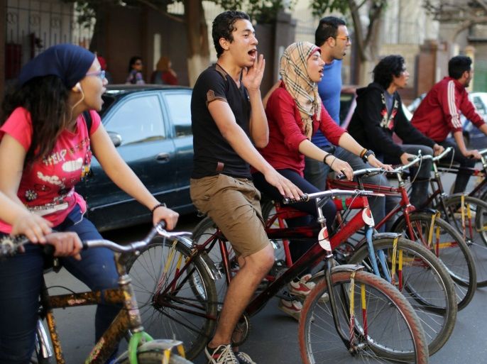 Protesters from ''6th of April'' group and other opposition activists chant slogans on bicycles as they take part in what they dub a