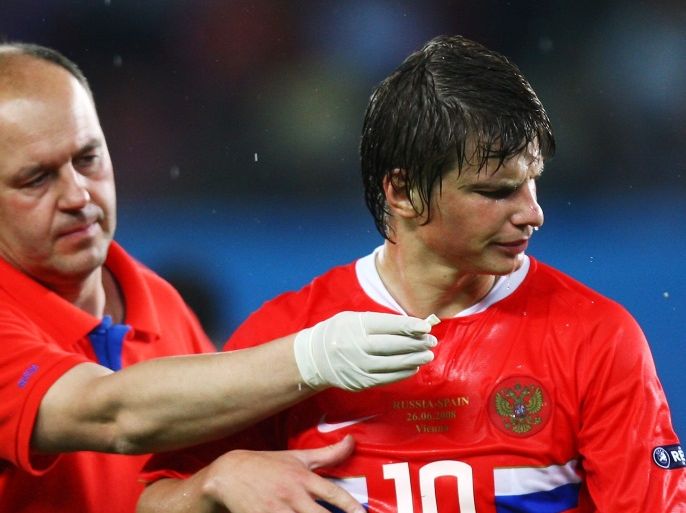 VIENNA, AUSTRIA - JUNE 26: Andrei Arshavin of Russia is given smelling salts during the UEFA EURO 2008 Semi Final match between Russia and Spain at Ernst Happel Stadion on June 26, 2008 in Vienna, Austria. (Photo by Andreas Rentz/Bongarts/Getty Images)