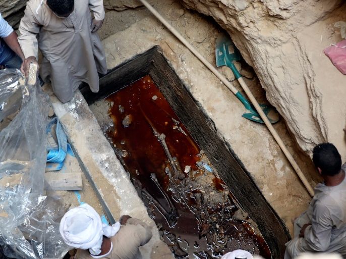 Workers unearth coffin containing three mummies with sewage water and bones inside in Alexandria, Egypt July 19, 2018. REUTERS/Mohamed Abd El Ghany