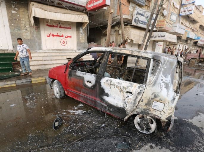 A man stands by a car damaged by a strike near al-Thawra Hospital in Hodeidah, Yemen August 2, 2018. REUTERS/Abduljabbar Zeyad
