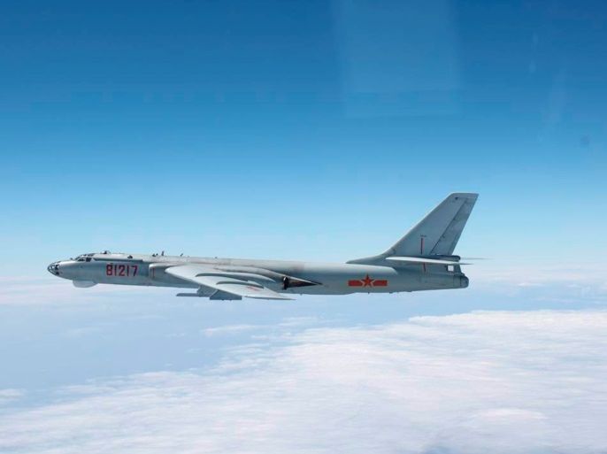 A Chinese military plane H-6 bomber flies through airspace between Okinawa prefecture's main island and the smaller