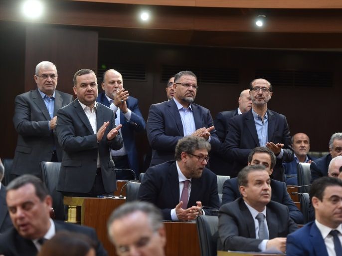 Members of Hezbollah parliamentary bloc gesture after Nabih Berri is re-elected as Lebanon's parliamentary speaker, as Lebanon's newly elected parliament convenes for the first time to elect a speaker and deputy speaker in Beirut, Lebanon May 23, 2018. Lebanese Parliament/Handout via REUTERS ATTENTION EDITORS - THIS IMAGE WAS PROVIDED BY A THIRD PARTY